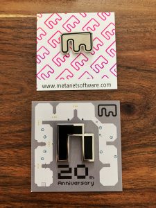 2 Hard enamel pins shaped like the N logo, and the Metanet Software logo